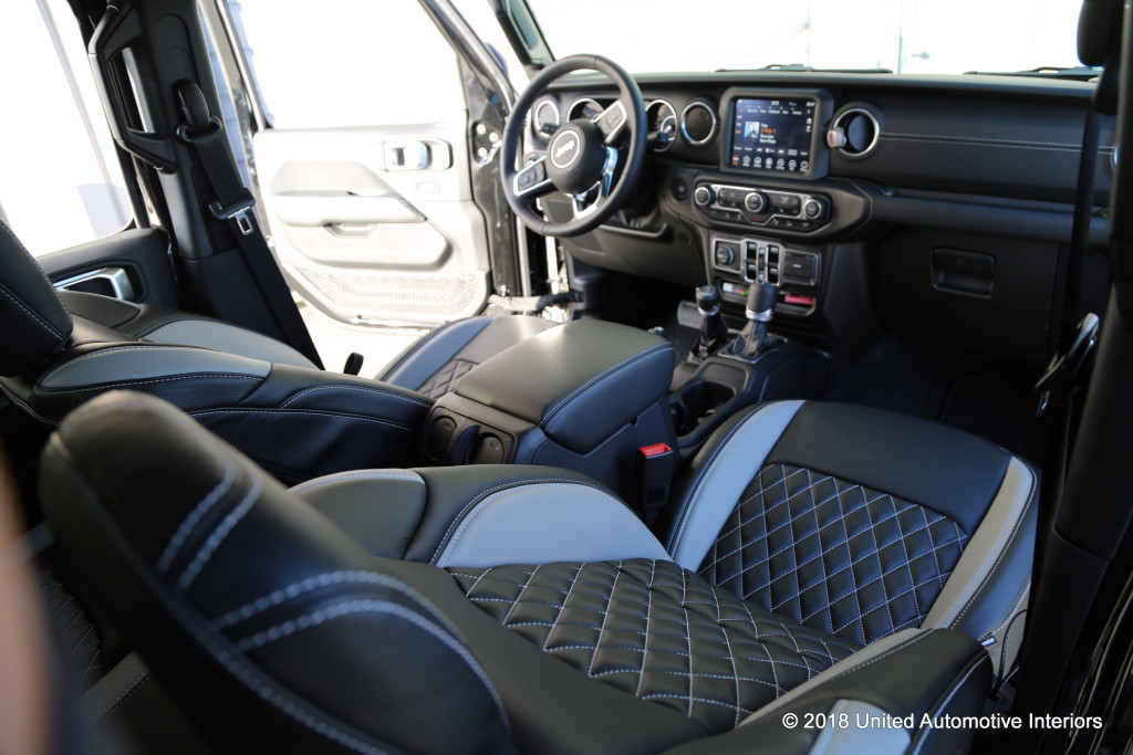 Custom interior for Jeep Wrangler in blue and black with diamond stitching