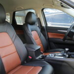 New aftermarket leather installation, black with brown inserts and brown door panels